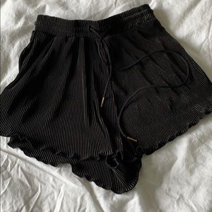 Black shorts, tie in front.